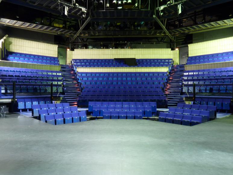 A view from the thrust stage to the auditorium seating at the Dundee Repertory Theatre.